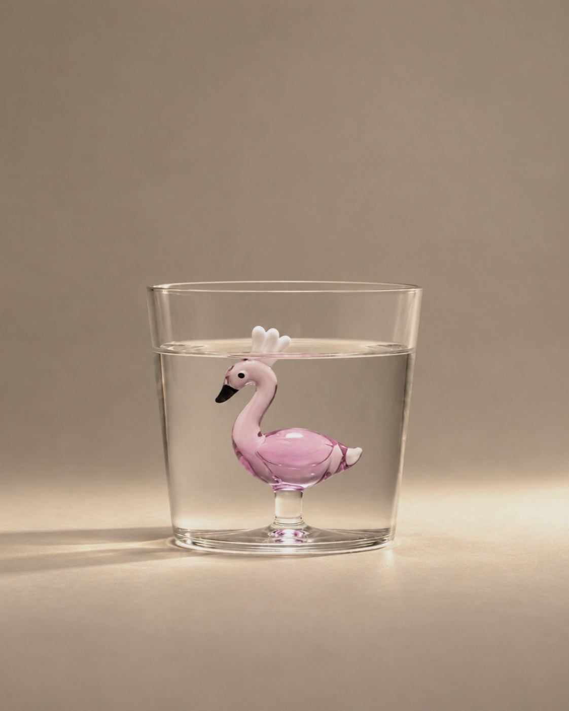 Flamingo Tumbler filled with water, a pink flamingo inside, photographed in the Son of Rand studio