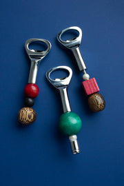 Beaded Bottle Opener by Yam, stainless steel opener with a handle strung from freshwater pearls and wooden beads