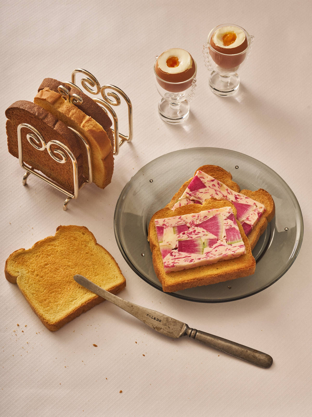 The Porter toast rack holding slices of toast beside eggs and a breakfast plate