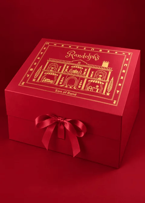 The red Randolph's gift box with a satin bow, turning slowly