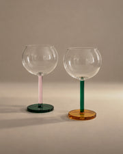 Bilboquet Wine Glasses in Golden Hour, a pair with pink and green stems, photographed in the Son of Rand studio