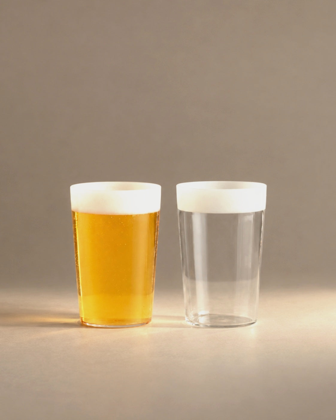 Ceres beer glasses with frosted white rims, studio photo