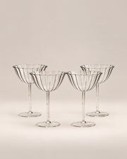 Set of four clear ribbed Cosmo coupes with scalloped rims, photographed in the Son of Rand studio