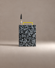 First Cut Gift Set: a black and white speckled cutting board with a confetti paring knife