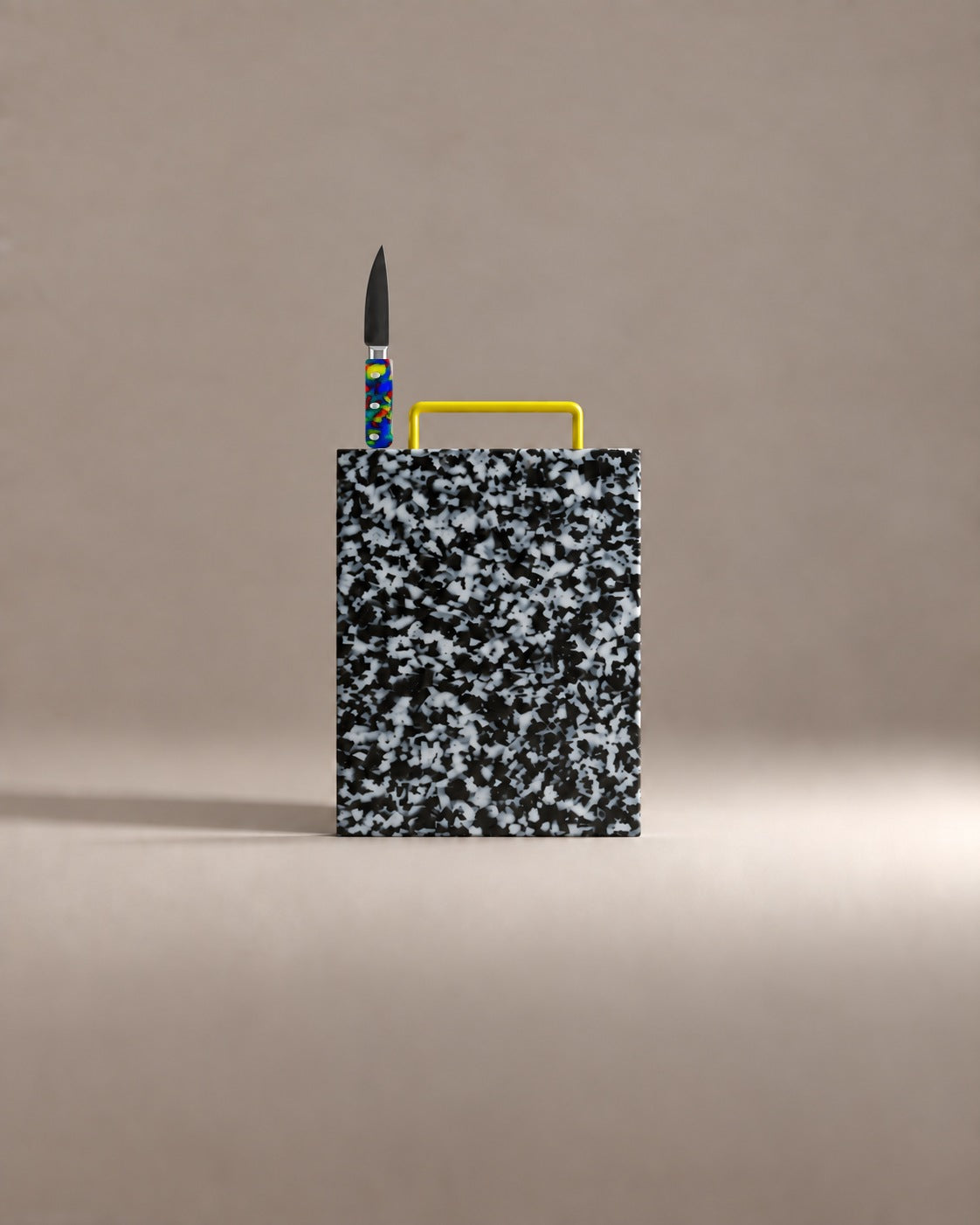 First Cut Gift Set: a black and white speckled cutting board with a rainbow handled paring knife