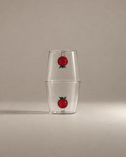 Fruit Stand Gift Set with two tomato glass tumblers stacked rim to rim on a warm greige background