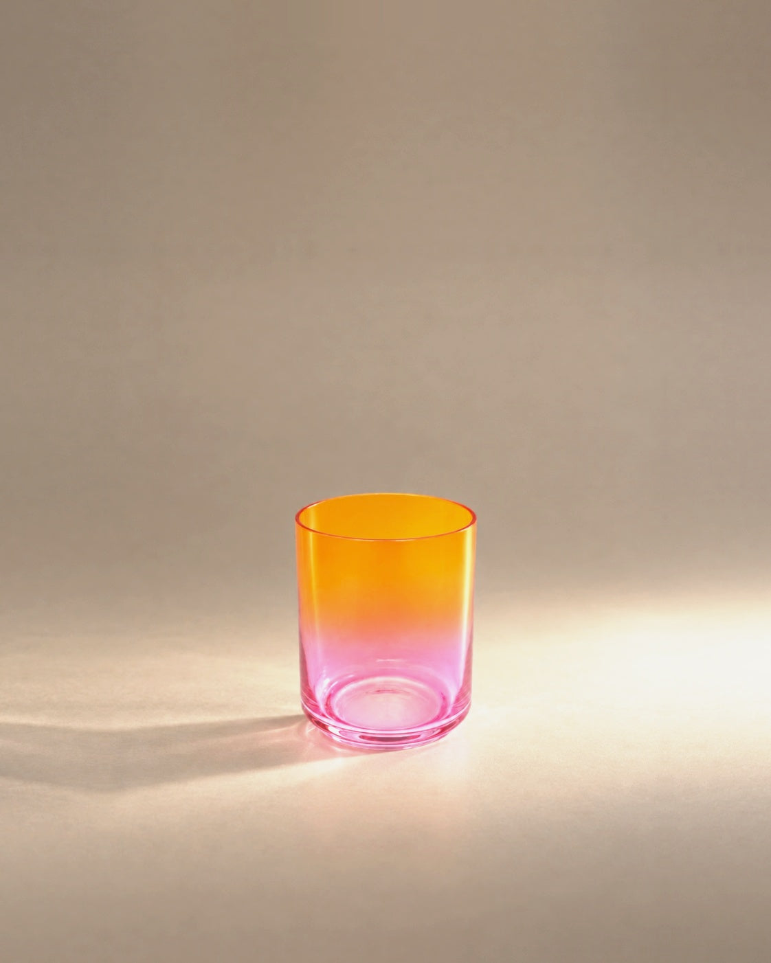 Gradient Glass in Acapulco, orange fading to pink, photographed in the Son of Rand studio