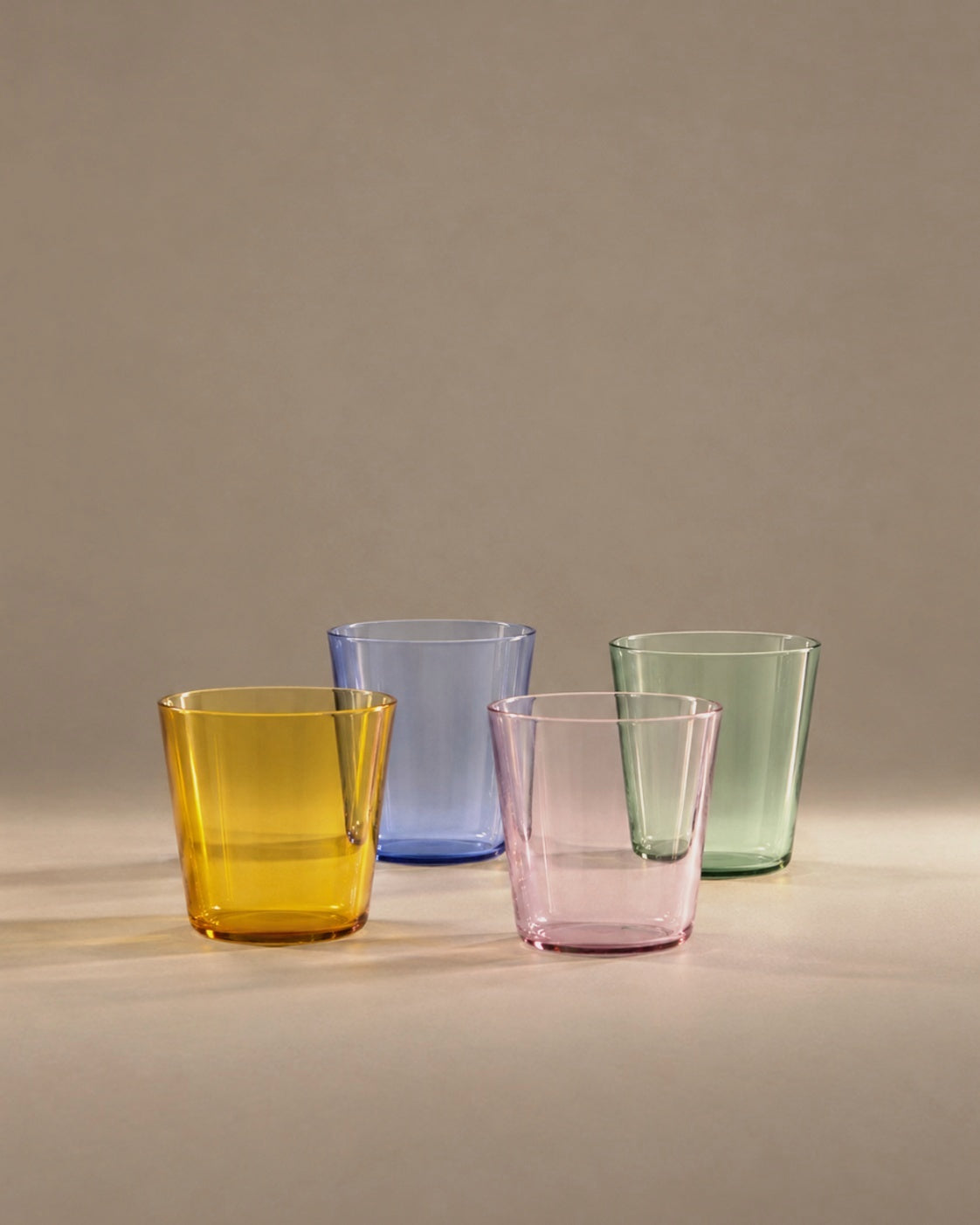 High Rise Tumbler in amber, light blue, pink and green, studio photograph