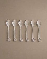 L'Escargot dessert spoons with spiral snail handles, flat lay studio photo