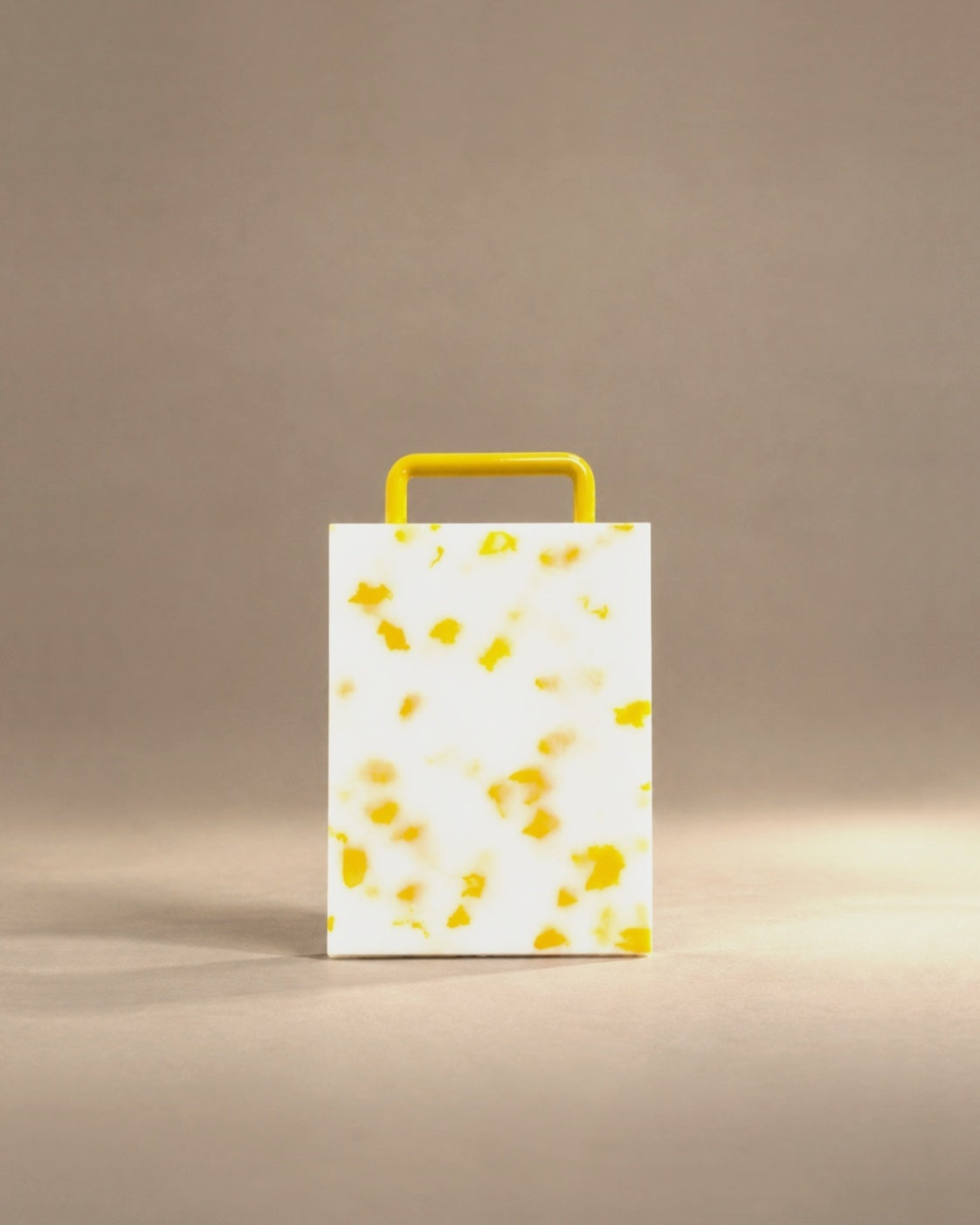 Mini cutting board in yellow confetti, studio photo