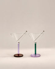 Pair of Piano cocktail glasses in Birdland with lilac and green stems and steel skewers, photographed in the Son of Rand studio