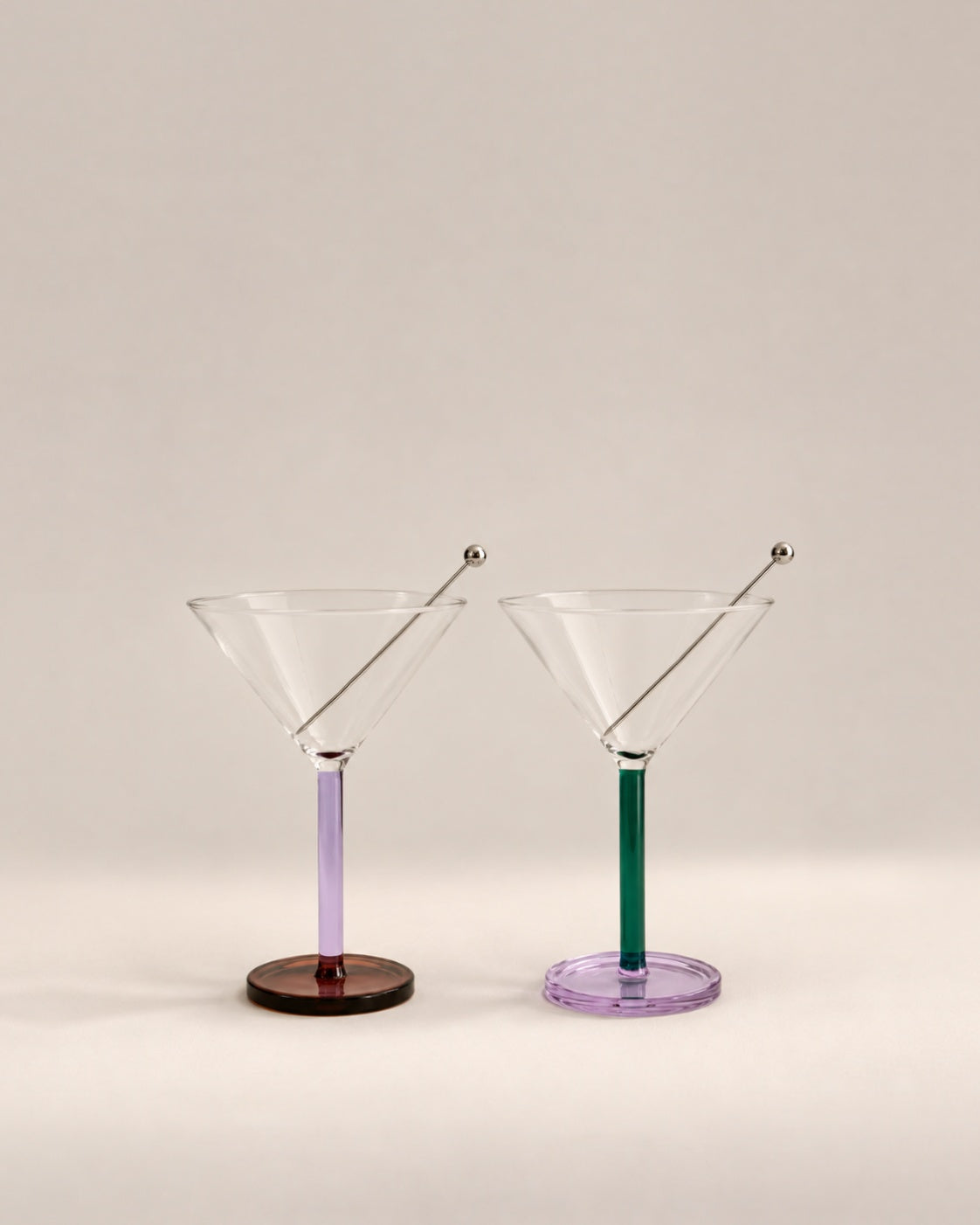 Pair of Piano cocktail glasses in Birdland with lilac and green stems and steel skewers, photographed in the Son of Rand studio