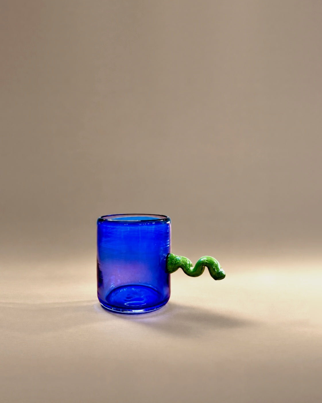 Squiggle Cup in Ultramarine + Peridot by Sticky Glass x Son of Rand, photographed in the Son of Rand studio