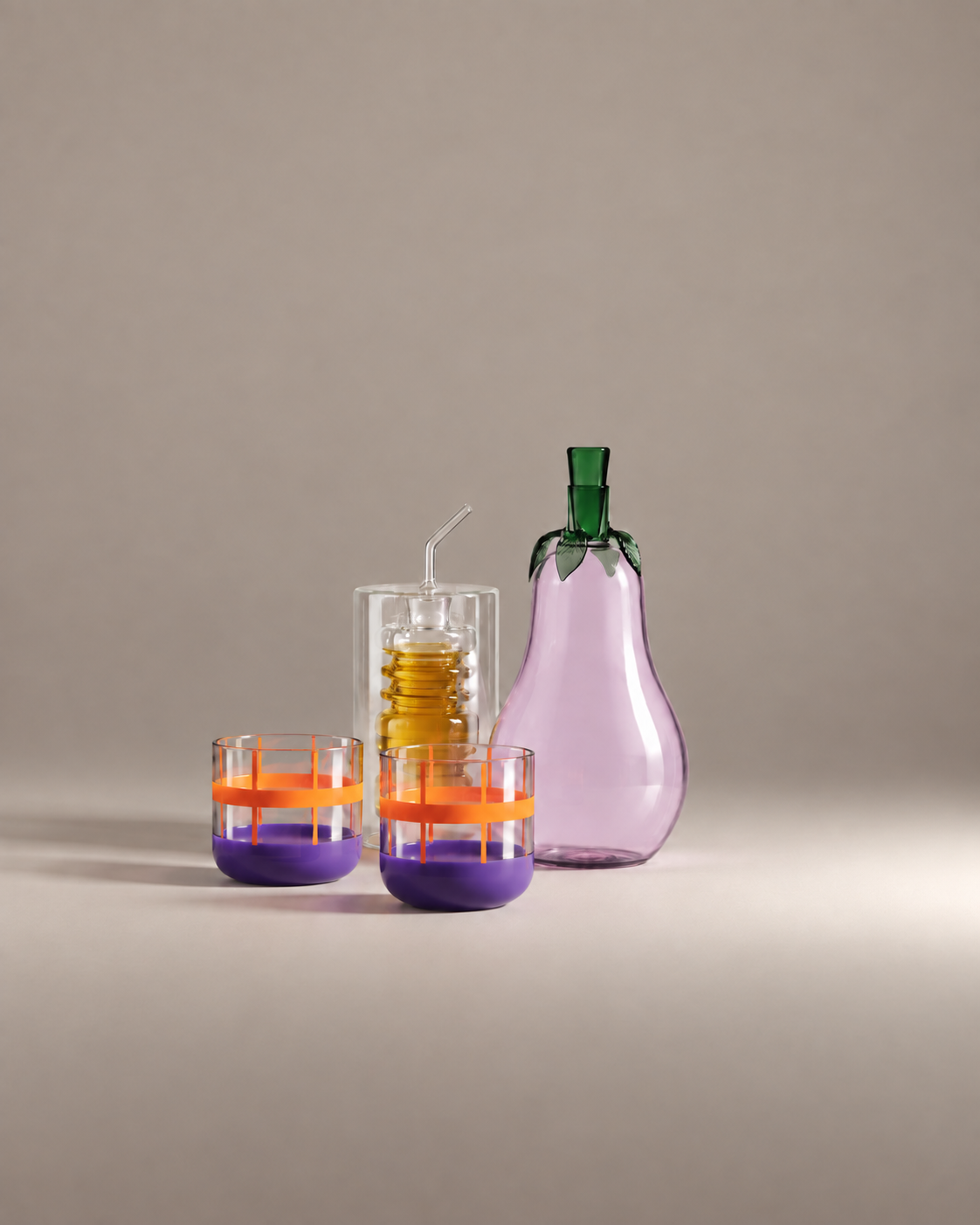 Sunday Supper Gift Set: a glass eggplant bottle, a ringed olive oil bottle and two orange and lilac banded tumblers