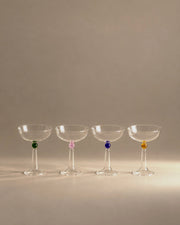 Tassel champagne coupe set of four with coloured glass beads, studio photo