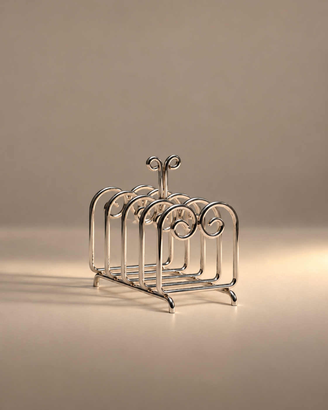 The Porter toast rack by Sophie Lou Jacobsen, with curled metal dividers in warm light