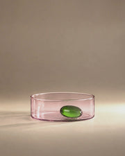 Travasi Olive Bowl in pink glass with a green glass olive, studio photograph