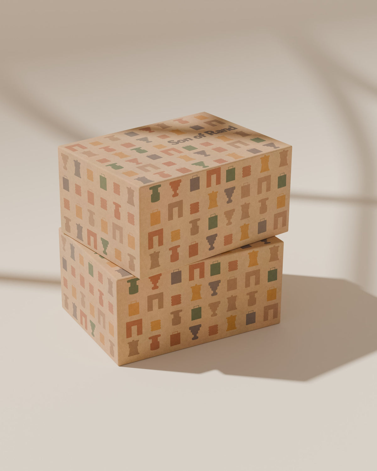 Two Son of Rand Seasonal Boxes stacked in window light